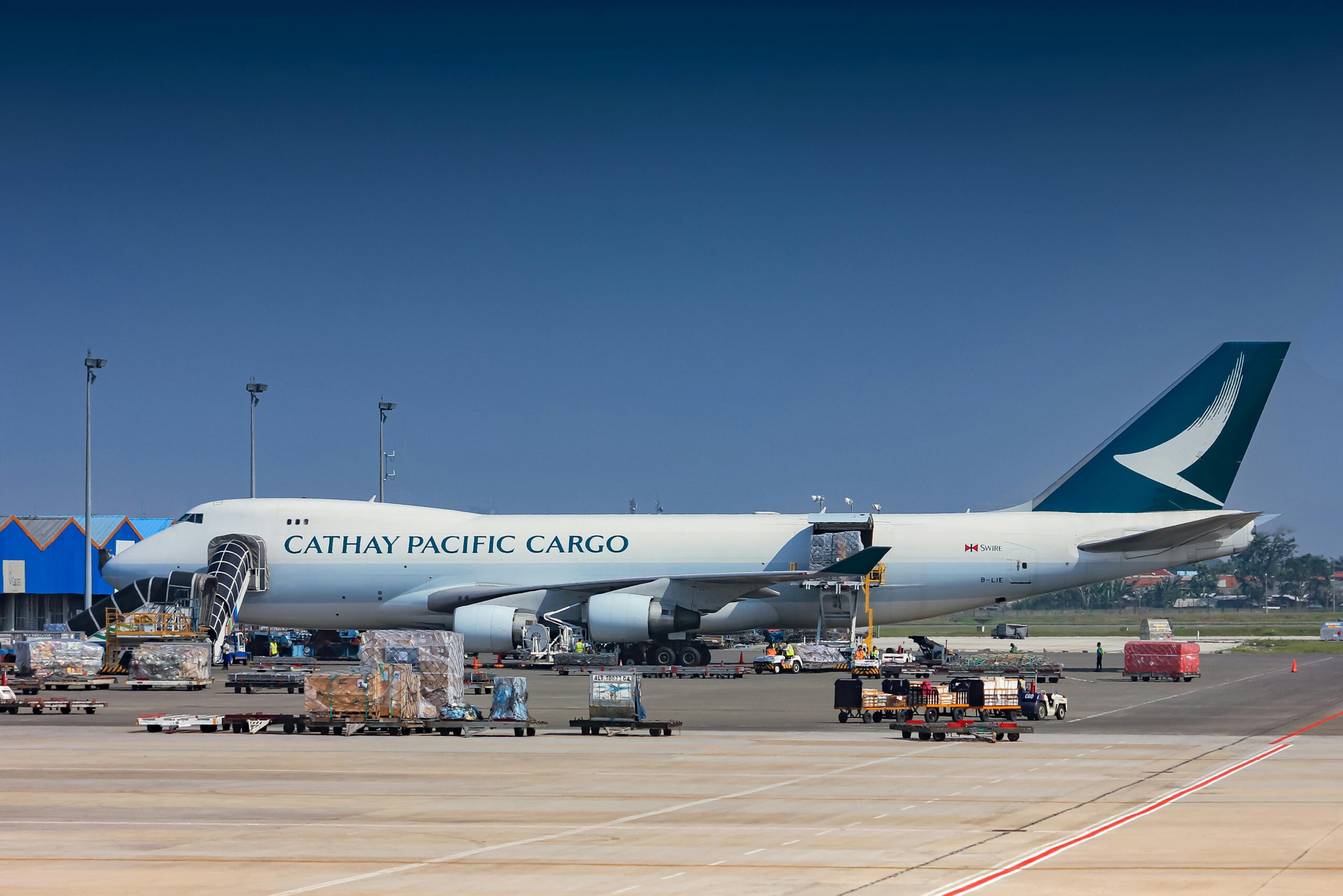 Cathay Pacific Cargo aircraft being loaded at Soekarno-Hatta Airport, Indonesia.